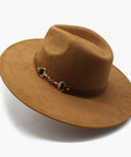 Brown fedora hat with a decorative band on a white background