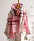 Gradient Pink and white plaid scarf with fringe on a mannequin against a white background