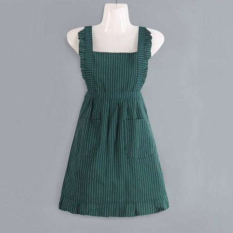 Green pinafore apron on a mannequin against a gray background