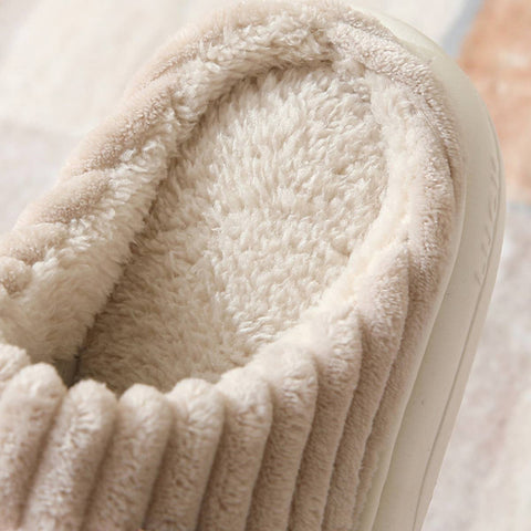 Close-up of a fluffy beige slipper with a soft texture.