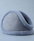 Light gray fleece-lined earmuffs with a soft fuzzy trim, photographed on a clean light gray studio background.