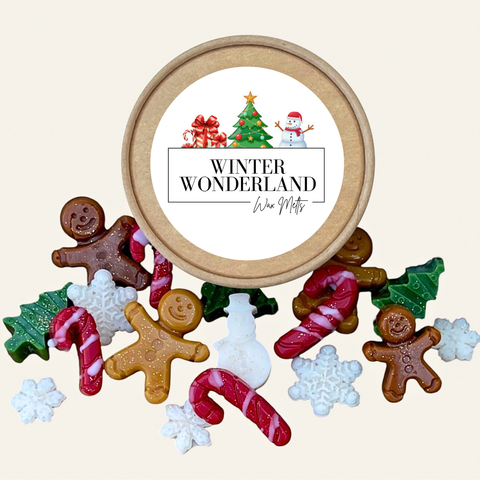 A round kraft paper gift box labeled 'WINTER WONDERLAND' with illustrated holiday graphics, surrounded by assorted gingerbread-themed and Christmas-shaped soaps on a light beige background.