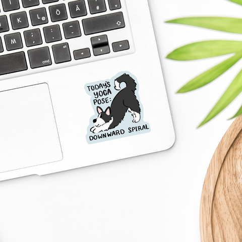 Sticker with a dog doing yoga illustration on a laptop