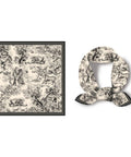 Decorative black and white scarf with vintage-style pattern on a white background. Pattern includes monkeys, trees, and other subtle jungle imagery.