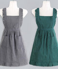 Two striped aprons on mannequins, one gray and one green, against a gray background.
