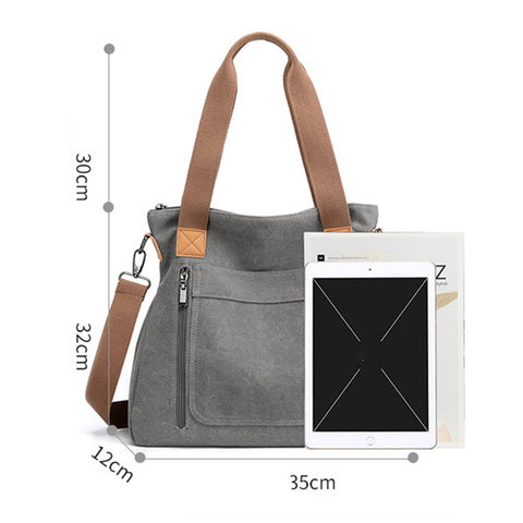 Gray canvas shoulder bag with brown straps and trim, shown with dimension markers (30cm height, 32cm strap height, 12cm width, 35cm overall) and a tablet prop on a white background.