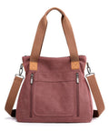 Dusty rose handbag with brown straps on a white background